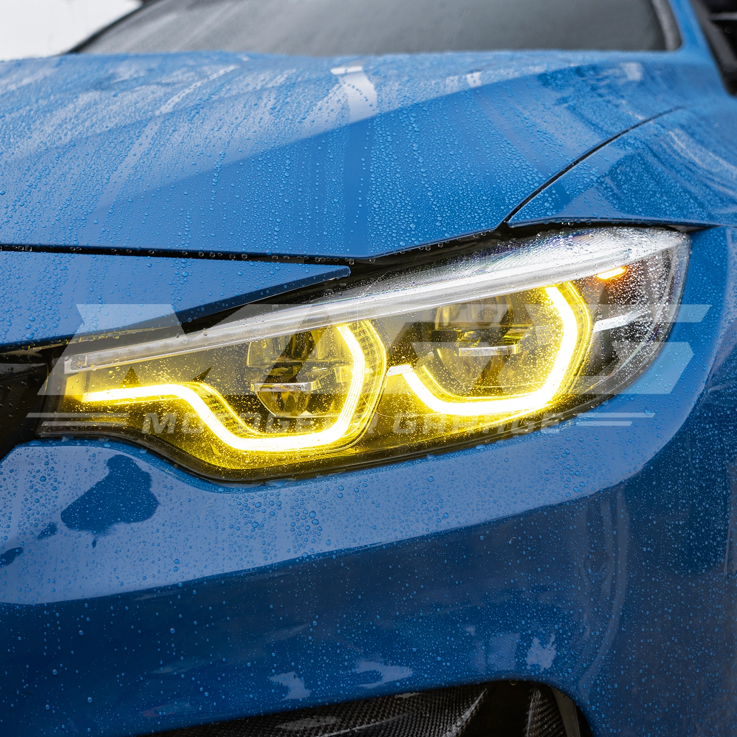 BMW F82 M4 with CSL style yellow DRL LED modules ON.