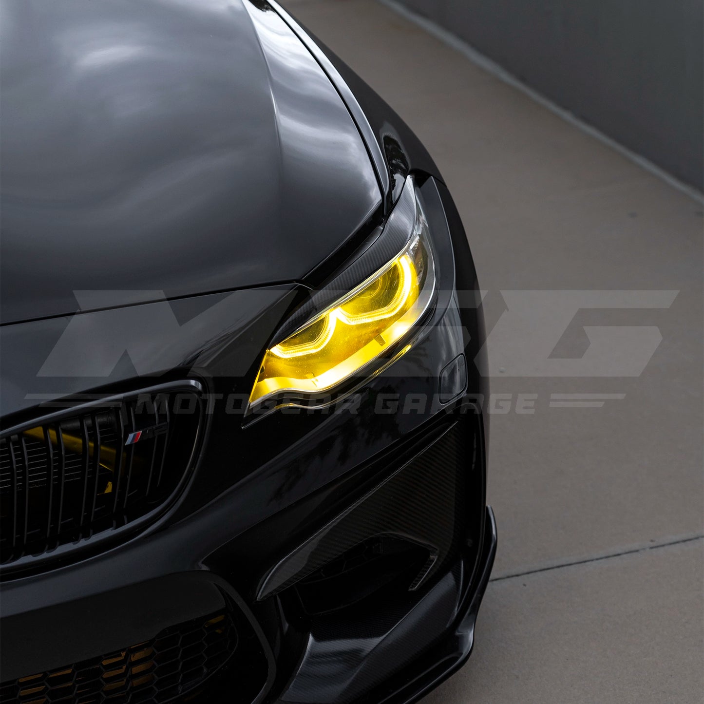 BMW F87 M2 with CSL style yellow DRL LED modules ON.