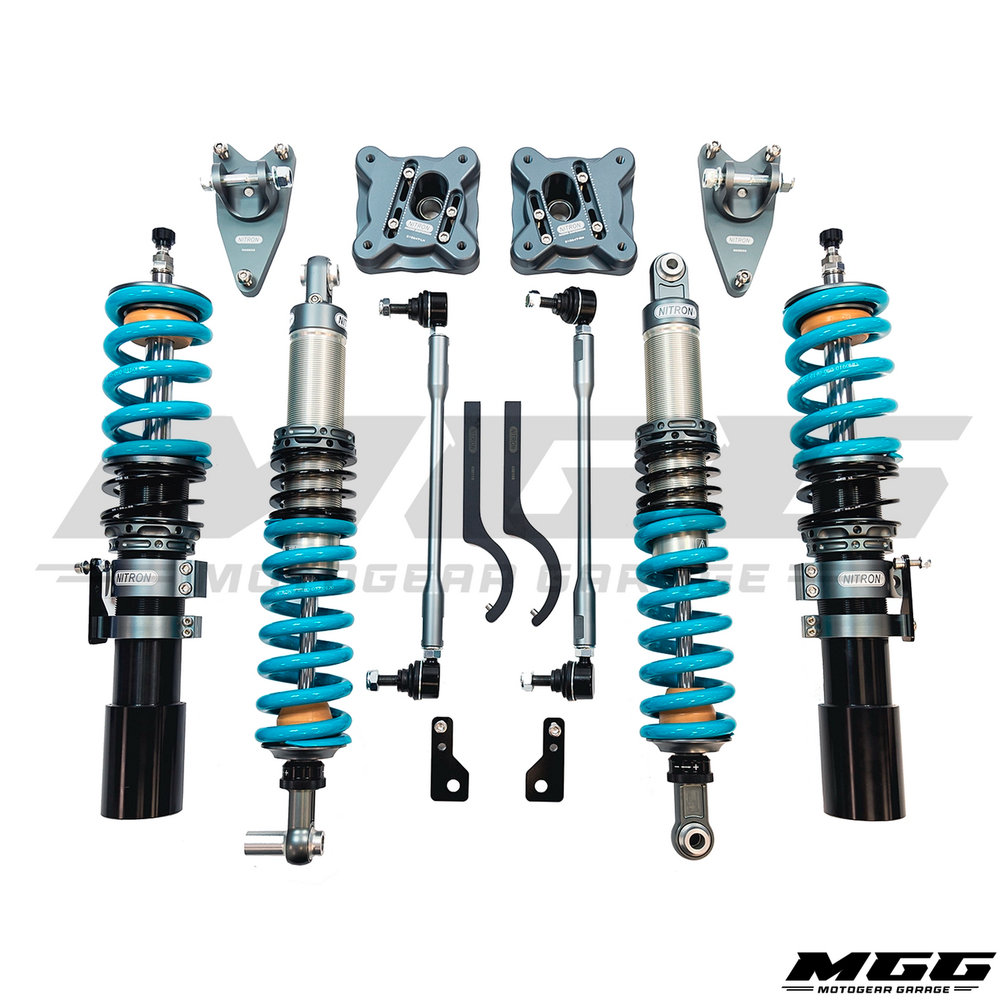 A complete Nitron Suspension R1 coilover kit for 2021+ BMW G8X M2, M3, & M4 RWD / xDrive laid out on a white background, including two blue-coated coilover springs with black and silver shock absorbers, silver control arms, knuckle bushings, and various black and silver hardware components.