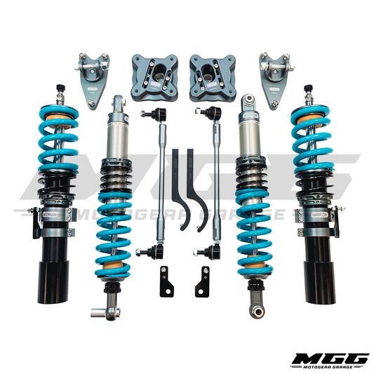 A complete Nitron Suspension R1 coilover kit for 2021+ BMW G8X M2, M3, & M4 RWD / xDrive laid out on a white background, including two blue-coated coilover springs with black and silver shock absorbers, silver control arms, knuckle bushings, and various black and silver hardware components.